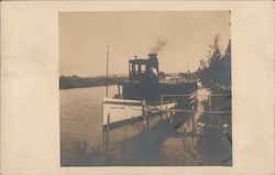 Small boat "Pastime" at a river bank Postcard