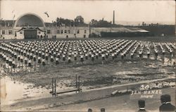 Uniformed Women exercising in large muddy field Postcard