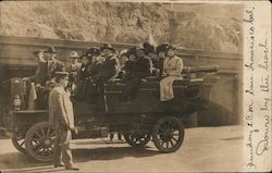 A dozen tourists in open-air automobile down by the beach, Cliff House Postcard