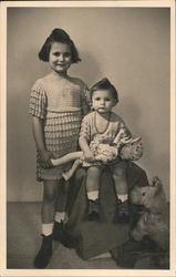 Children with Babydoll and Stuffed Dog Postcard
