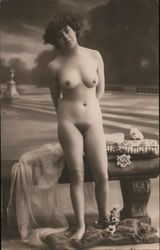 Naked Woman standing in front of bench Postcard