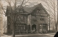 Gothic-style brick and dark wood multi-story mansion Postcard