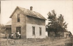 Two Children and Pony Adjacent to Old House Postcard