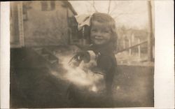 Girl Holding Puppy Postcard
