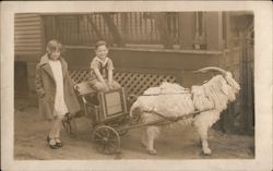 Children in Goat-Drawn Toy Cart Postcard