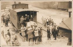 Victims of train crash loaded onto caboose, August 25th 1911 Postcard