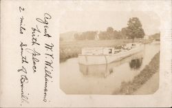 Large Flat Bottom Boat in Narrow Waterway Postcard