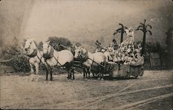 Porter photo. Horse-drawn parade float carrying group of women. Postcard