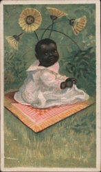 Baby sitting on a blanket in a field with flowers Trade Cards Trade Card Trade Card Trade Card