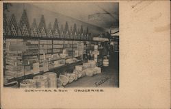 Guenther & Son Groceries, interior of grocery store with stacks of cans and barrels of goods Postcard