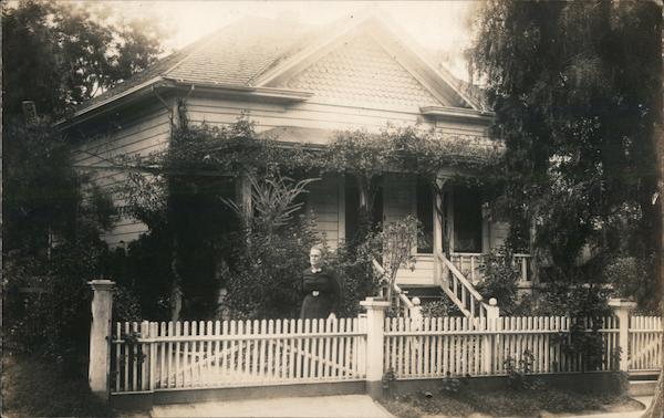 Woman outside Home Buildings