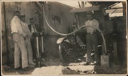 1921 Four Men at Gas Pump and Service Station Postcard