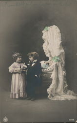 Young Boy and Girl Dressed Up Next to Crib Postcard