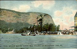 Chas. Nelson making Canoe Mile record on Moosehead Lake Maine Postcard Postcard