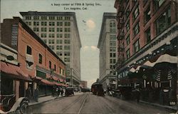 A busy corner at Fifth & Spring Streets Postcard