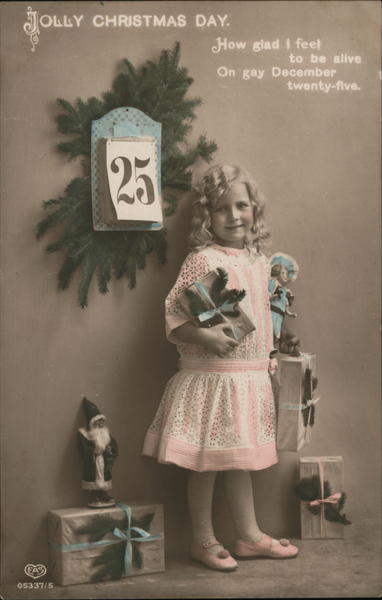 Young Girl Holding Gifts in Front of Calendar With 25th On It