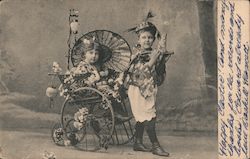 Children in Native Clothing and Flowers Postcard