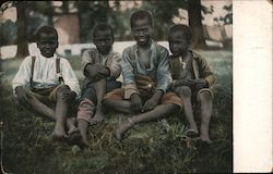Four Smiling African American Boys Sitting On The Grass Postcard