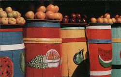Fruit sitting on colorful baskets painted to show other fruits Postcard