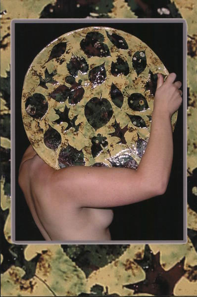 A woman is holding a piece of pottery on her shoulder, covering her face. Lebanon Pennsylvania