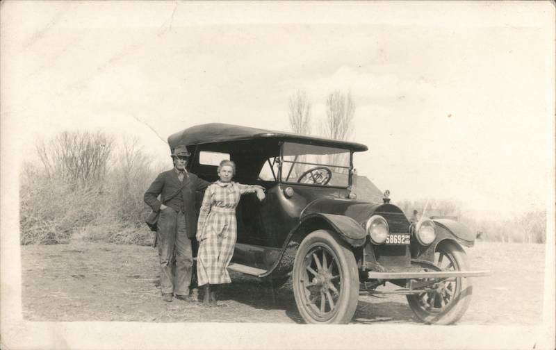 Man and woman pose by car 1920 License Plate 58692 Oregon