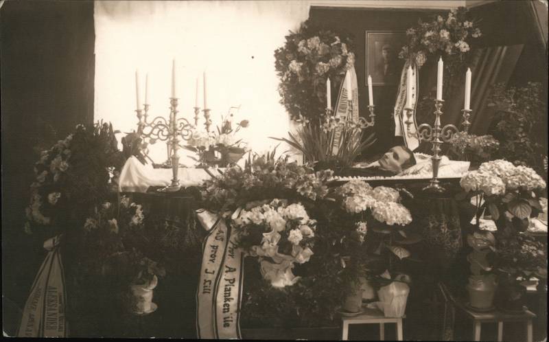 Man Lying in Coffin Surrounded by Flowers, Post-Mortem