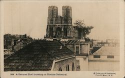A German shell bursting on Rheims Cathedral Postcard