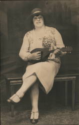 A Woman Playing the Mandolin Postcard