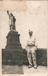 Uniformed military man standing in front of the Statue of Liberty People in Uniform Postcard Postcard Postcard