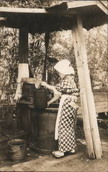 Woman Drawing Water in Tokyo Postcard