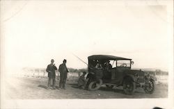 Men Changing Tire on Old Touring Car Postcard