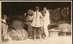 Chinese Workers with Large Woven Baskets and an Umbrella Postcard