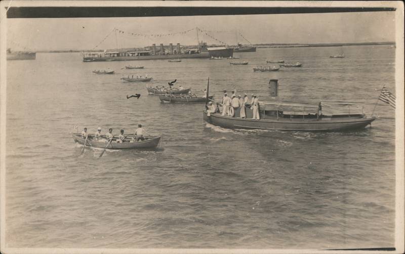 Navy Sailors Racing Rowboats