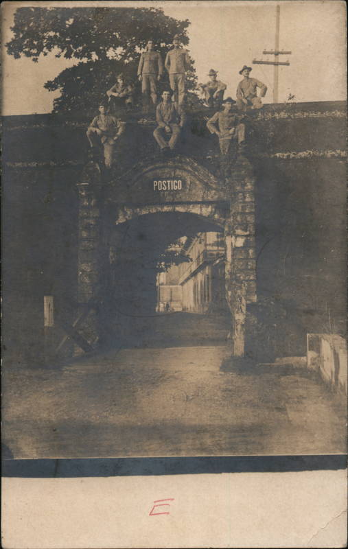 Soldiers Sitting on Archway of Brick Wall Men