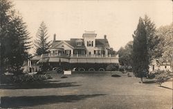 Three Story Home With First Floor Awnings and Second Floor Wrap Around Deck Postcard