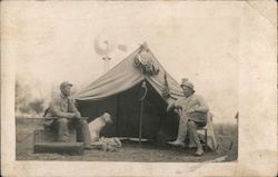 Two men sitting with their hunting dog Postcard