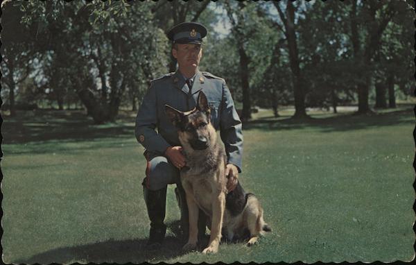 A Member of the Ontario Provincial Police Search and Rescue Canine Team and his dog Butch Canada