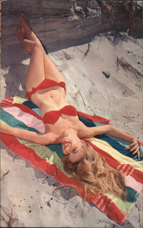 Woman sunbathing in red bikini Swimsuits & Pinup
