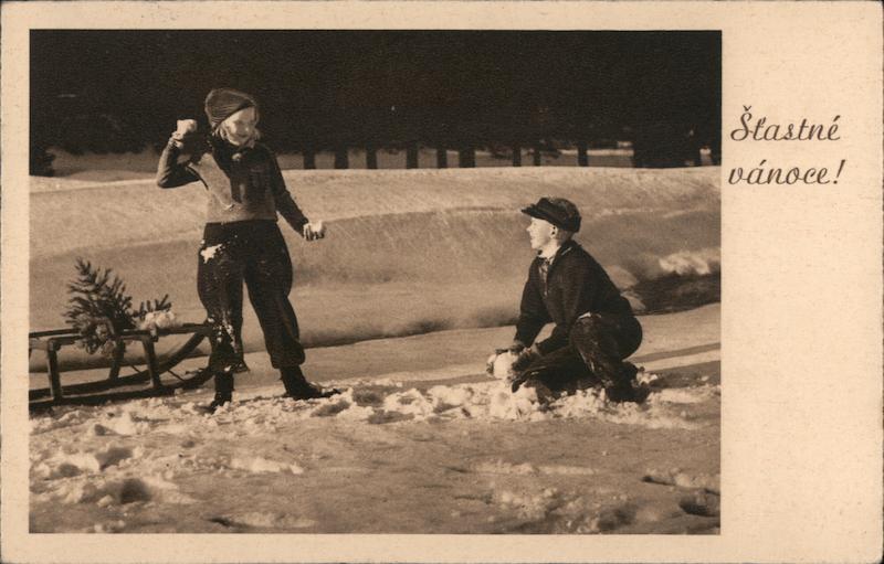 Stastne Vanoce (Merry Christmas in Slovak) -Young Boy and Girl having a Snowball Fight