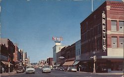 Looking down Front Street, the center of the Retail Business Section Postcard