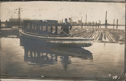 Man with Small Boat, Logs Near Piers/Wharf Postcard
