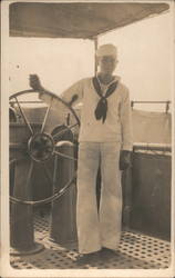 Sailor Standing Next to Ship's Wheel Postcard