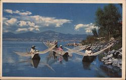 Native fishermen with their primitive canoes and butterfly nets ply their trade on Lake Patzucaro Lake Patzcuaro, Mexico Postcar Postcard