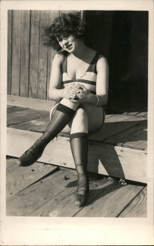 Flapper Bathing Beauty Sitting on Wooden Step Swimsuits & Pinup