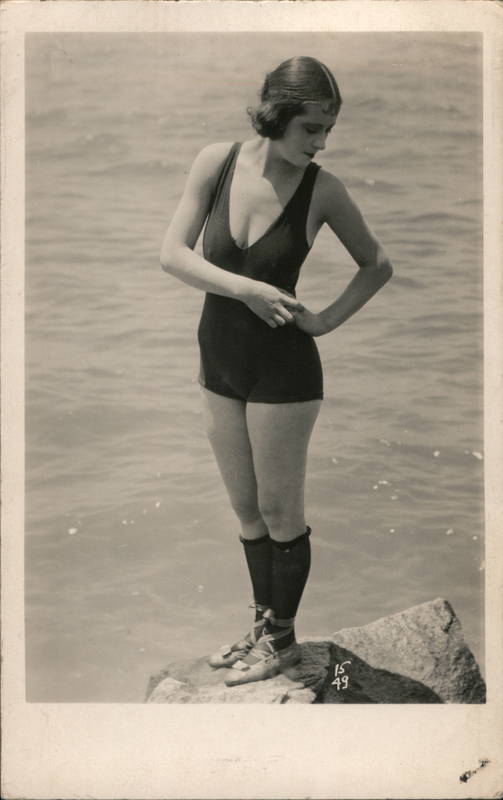 Flapper Woman in Bathing Suit Standing on Rocks 1920s