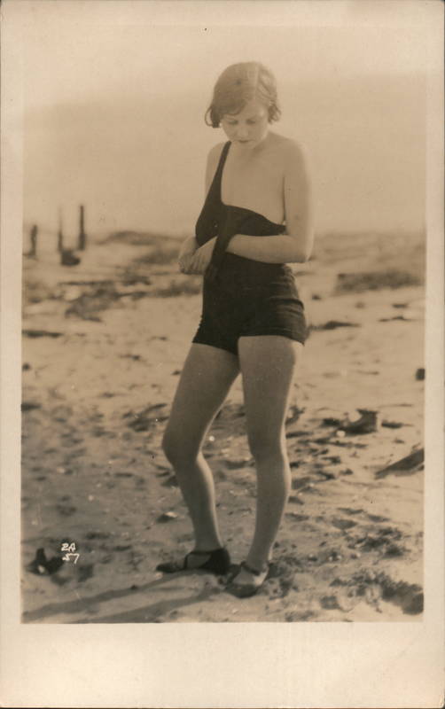 Flapper Woman on a beach taking off bathing suit Swimsuits & Pinup