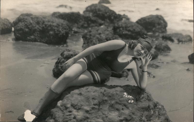 Flapper Woman on rock Swimsuits & Pinup