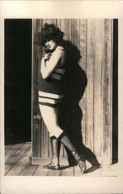 Flapper Brunette woman poses Swimsuits & Pinup