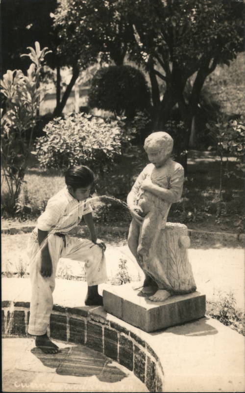 Boy drinks from Peeing  fountain Mexico Children