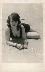 Flapper Woman lies on beach Postcard